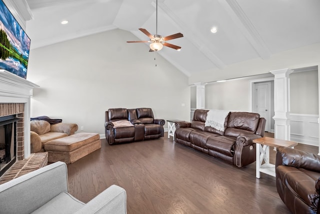 2027 S County Road 9, Newton, AL 36352 - living room featuring decorative columns, ceiling fan, a fireplace, high vaulted ceiling, and dark wood-type flooring