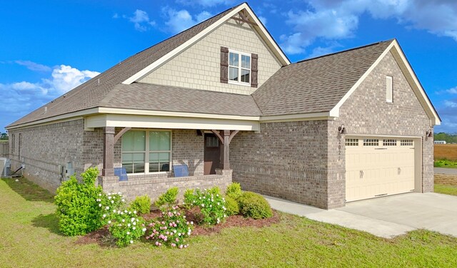 2027 S County Road 9, Newton, AL 36352 - view of front of home featuring brick siding, an attached garage, concrete driveway, a front lawn, and a shingled roof