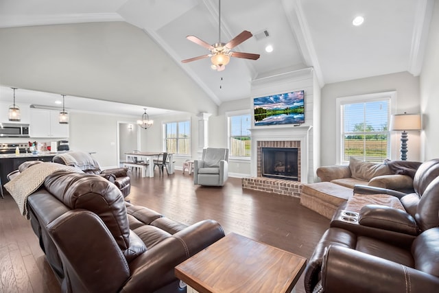 2027 S County Road 9, Newton, AL 36352 - living room with a ceiling fan, dark wood-style floors, a brick fireplace, a chandelier, and high vaulted ceiling