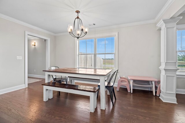 2027 S County Road 9, Newton, AL 36352 - dining space with decorative columns, crown molding, dark wood-style flooring, and a chandelier