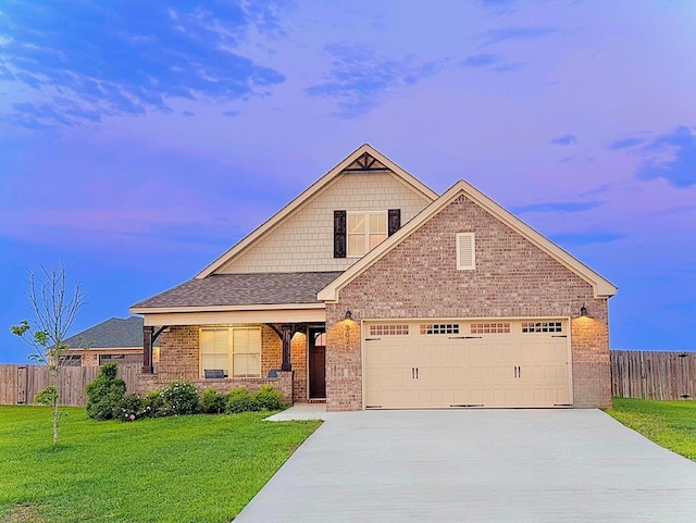 2027 S County Road 9, Newton, AL 36352 - view of front of house with concrete driveway, brick siding, a garage, and roof with shingles