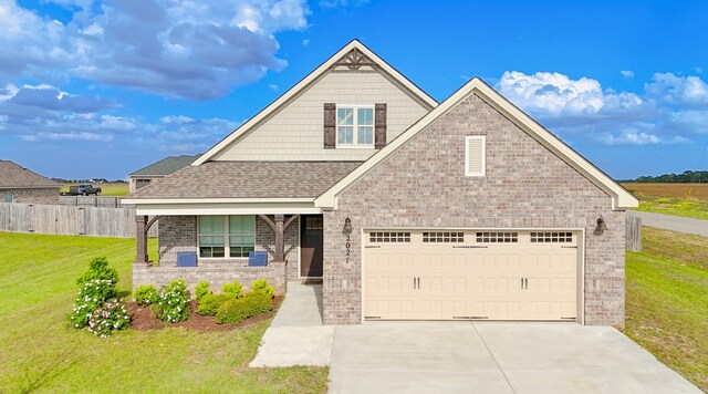 2027 S County Road 9, Newton, AL 36352 - view of front of house featuring brick siding, driveway, roof with shingles, and a garage