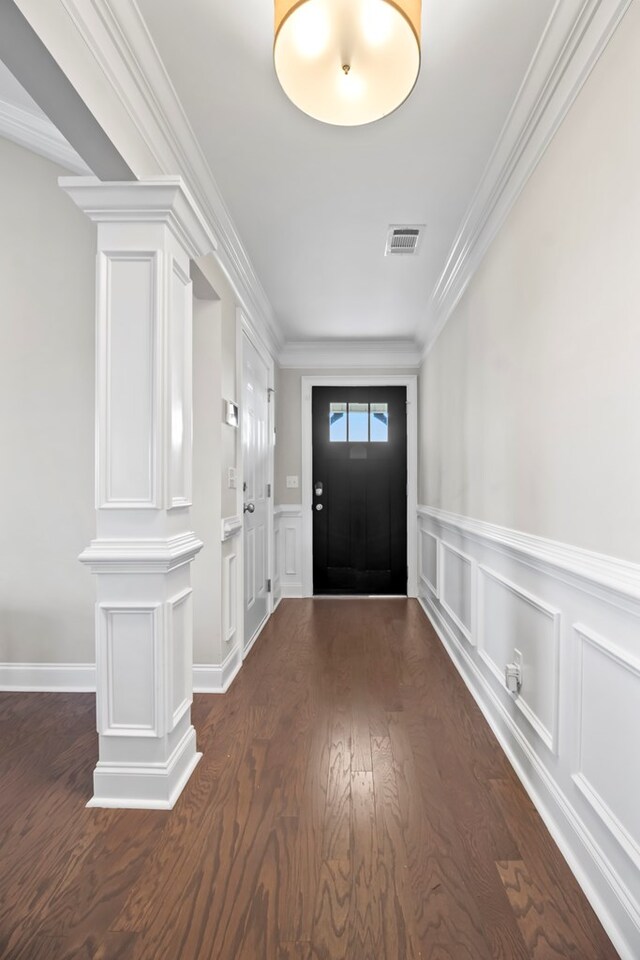 2027 S County Road 9, Newton, AL 36352 - entryway with a decorative wall, dark wood-style flooring, ornamental molding, a wainscoted wall, and ornate columns