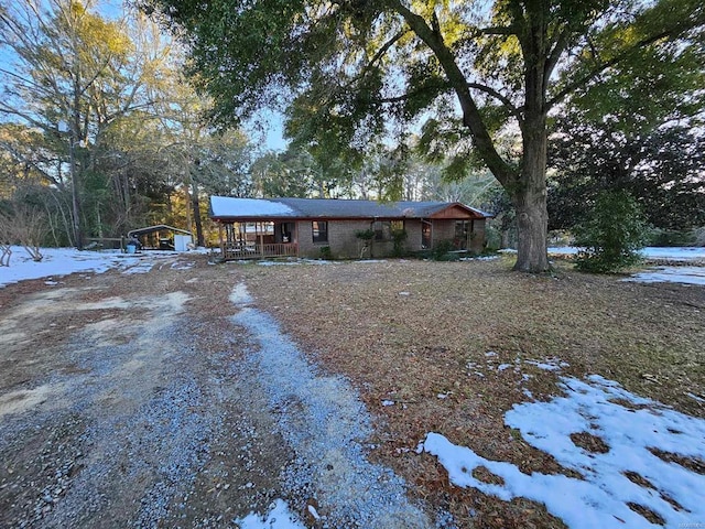 ranch-style house with covered porch