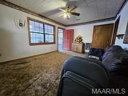 interior space featuring ceiling fan and ornamental molding