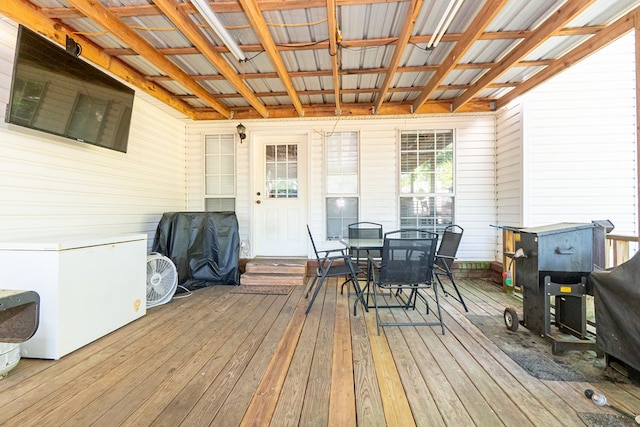 wooden terrace featuring outdoor dining space