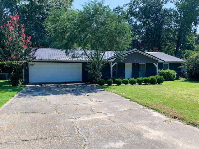 ranch-style house with a front yard and a garage