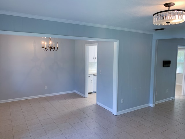 unfurnished room with a notable chandelier, light tile patterned floors, and crown molding