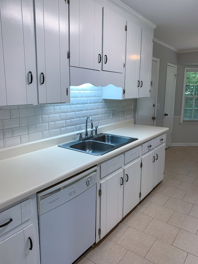 kitchen featuring dishwasher, white cabinetry, and sink