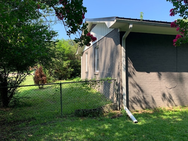 view of property exterior featuring a lawn