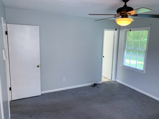 carpeted empty room with ceiling fan