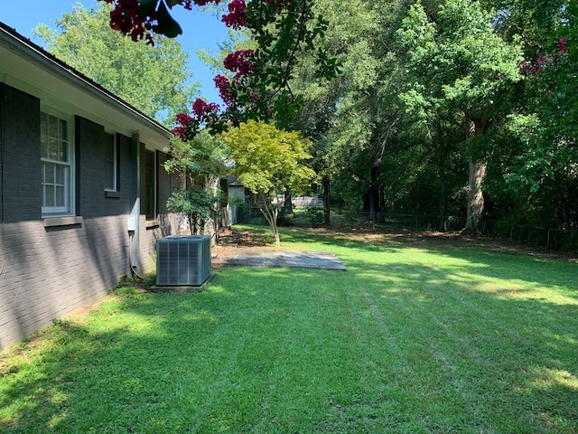 view of yard with central AC unit