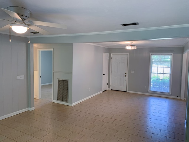 unfurnished room with ceiling fan, light tile patterned flooring, and ornamental molding