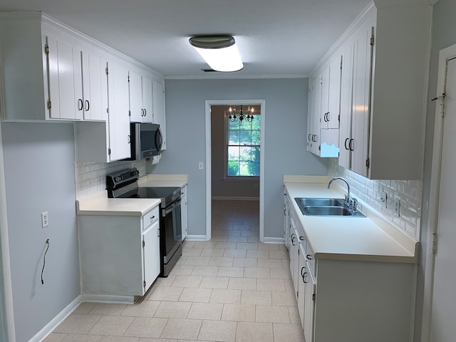 kitchen featuring backsplash, crown molding, sink, appliances with stainless steel finishes, and white cabinetry