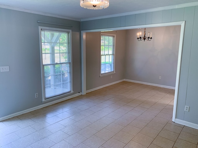 unfurnished room featuring a notable chandelier, light tile patterned floors, and crown molding