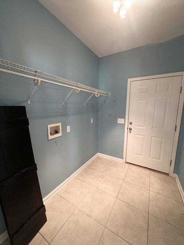 305 Millenia St, Enterprise, AL 36330 - laundry area with washer hookup, light tile patterned floors, and baseboards