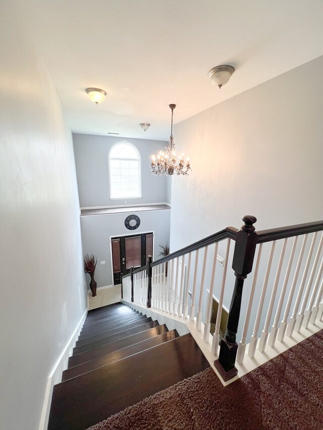 305 Millenia St, Enterprise, AL 36330 - stairs with a chandelier and baseboards