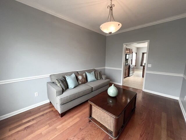 305 Millenia St, Enterprise, AL 36330 - living room featuring wood finished floors, ornamental molding, and baseboards