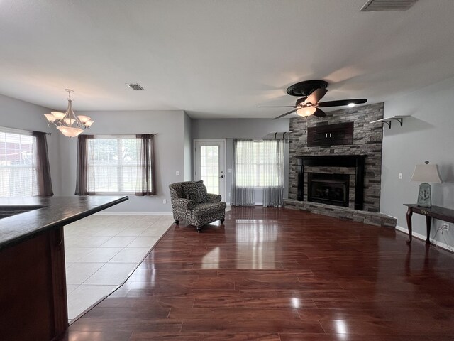 305 Millenia St, Enterprise, AL 36330 - living room featuring a ceiling fan, healthy amount of natural light, a chandelier, and a fireplace