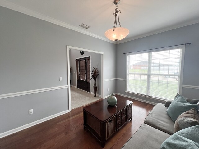 305 Millenia St, Enterprise, AL 36330 - living area with ornamental molding, dark wood-type flooring, and baseboards