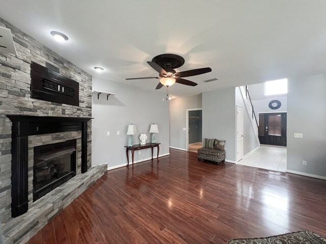 305 Millenia St, Enterprise, AL 36330 - living area with a fireplace, wood finished floors, a ceiling fan, and baseboards