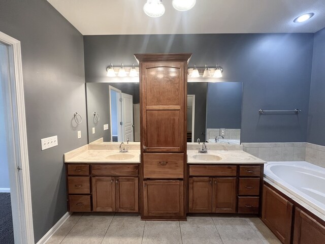 305 Millenia St, Enterprise, AL 36330 - bathroom featuring a bath, double vanity, and tile patterned flooring