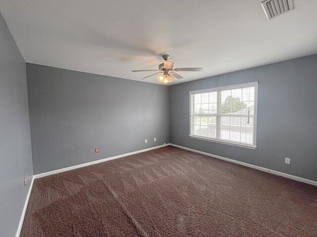 305 Millenia St, Enterprise, AL 36330 - empty room featuring a ceiling fan, baseboards, and dark colored carpet