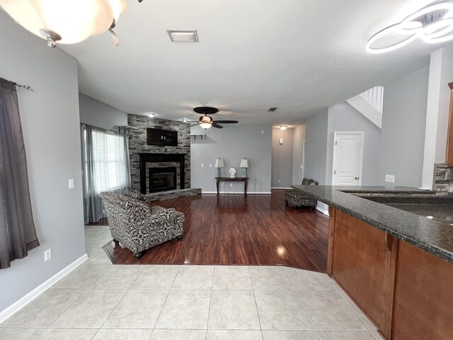 305 Millenia St, Enterprise, AL 36330 - living area with a fireplace, light tile patterned floors, and a ceiling fan