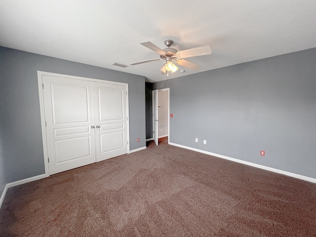 305 Millenia St, Enterprise, AL 36330 - unfurnished bedroom with baseboards, carpet floors, a closet, and a ceiling fan