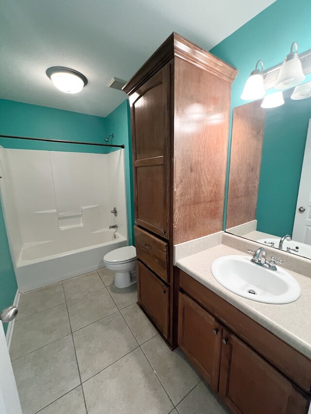 305 Millenia St, Enterprise, AL 36330 - full bathroom featuring toilet, tile patterned flooring, vanity, and bathing tub / shower combination