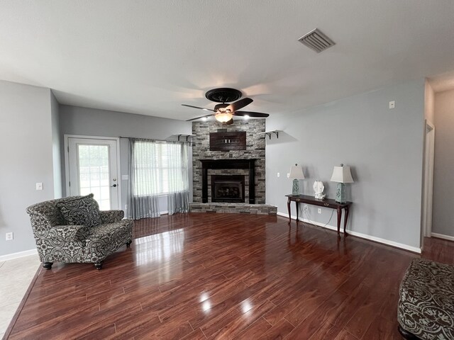 305 Millenia St, Enterprise, AL 36330 - living area with ceiling fan, wood finished floors, a fireplace, and baseboards