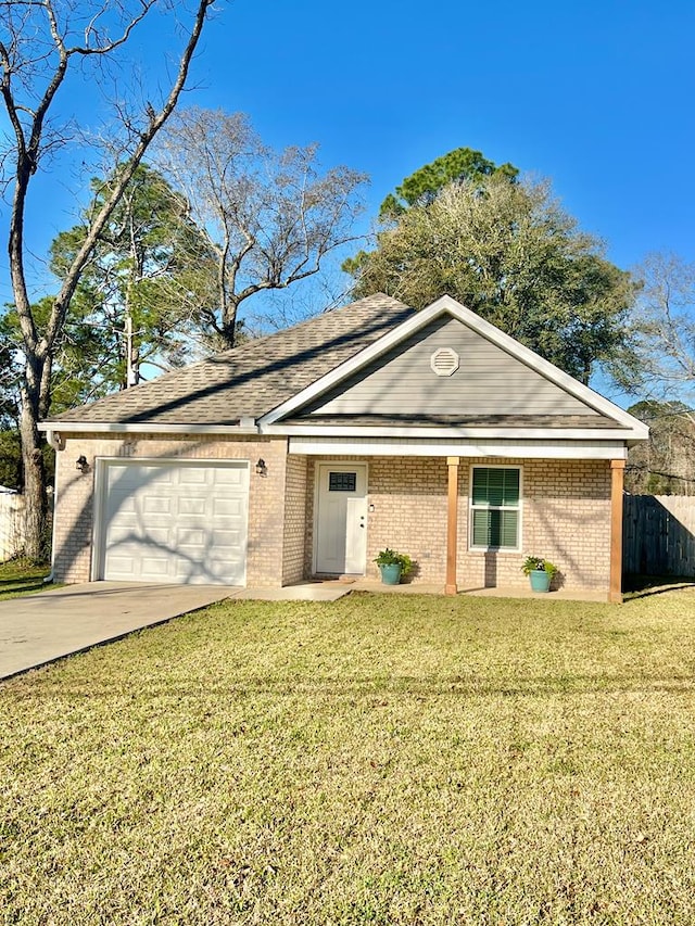 ranch-style house with brick siding, an attached garage, concrete driveway, and a front lawn