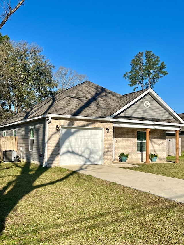 ranch-style house featuring brick siding, concrete driveway, a front lawn, and a garage