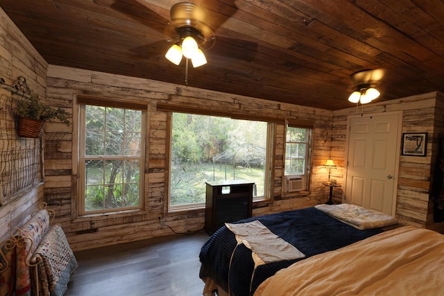 bedroom featuring multiple windows, ceiling fan, and wooden ceiling