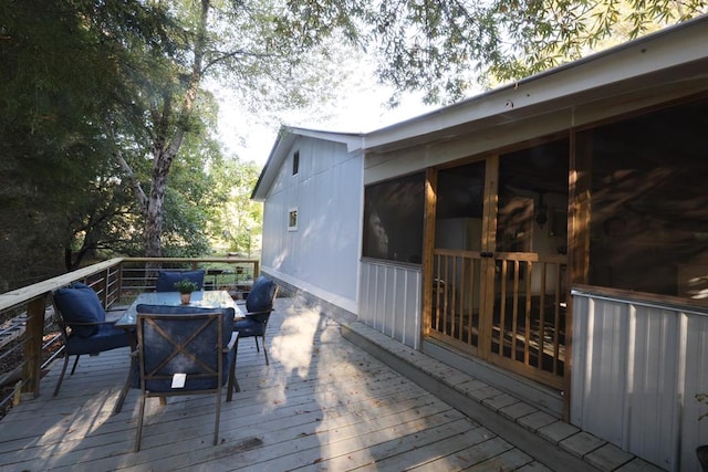 deck with a sunroom