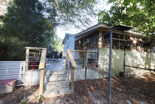 view of side of property featuring a wooden deck