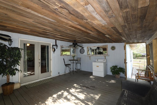 wooden deck featuring ceiling fan, french doors, and washer / dryer