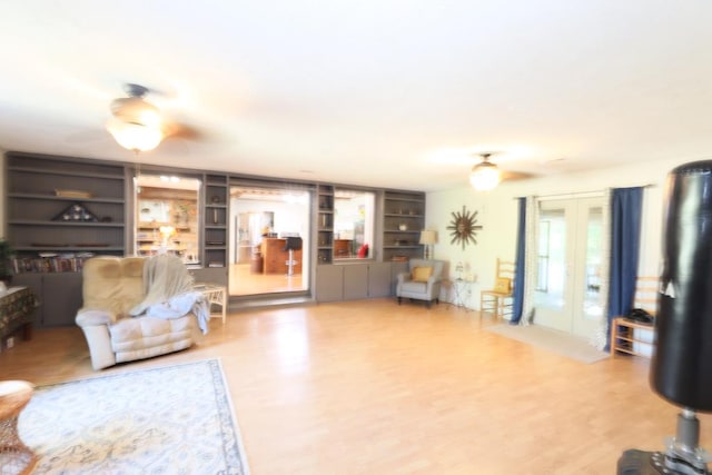 living room featuring french doors and built in shelves