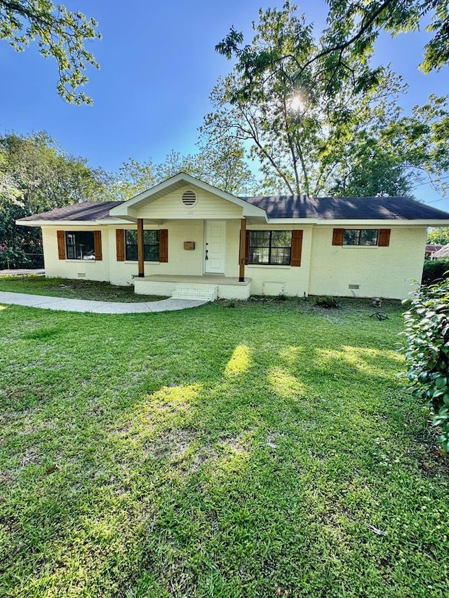 view of front of home with a porch and a front yard