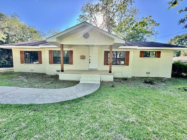 ranch-style home with a porch, crawl space, a front yard, brick siding, and a shingled roof