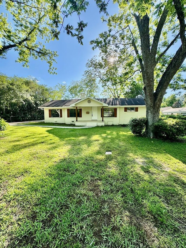 144 Forrest Ave, Slocomb, AL 36375 - back of house featuring a yard and stucco siding