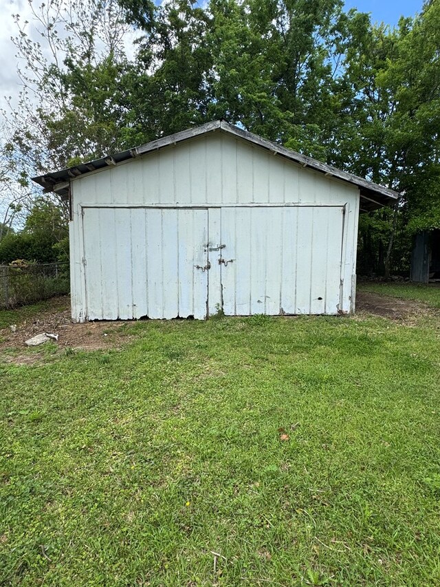 view of shed with fence