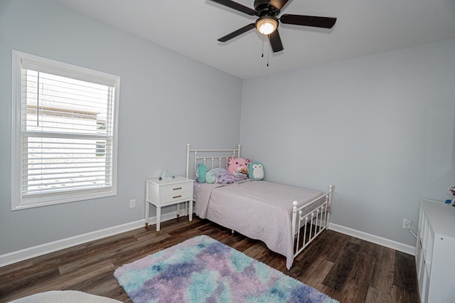 bedroom with wood finished floors, ceiling fan, and baseboards