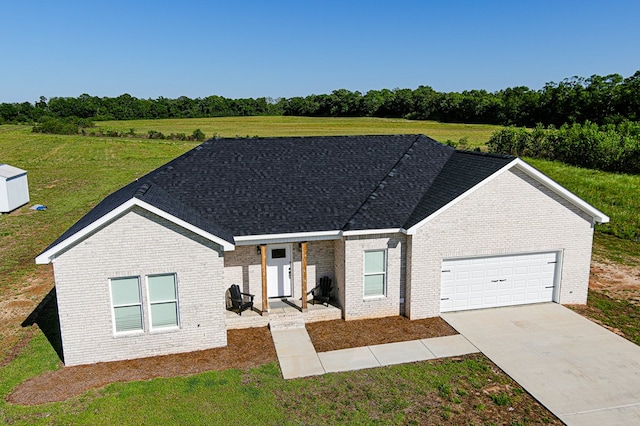 single story home with a garage, brick siding, concrete driveway, and a shingled roof