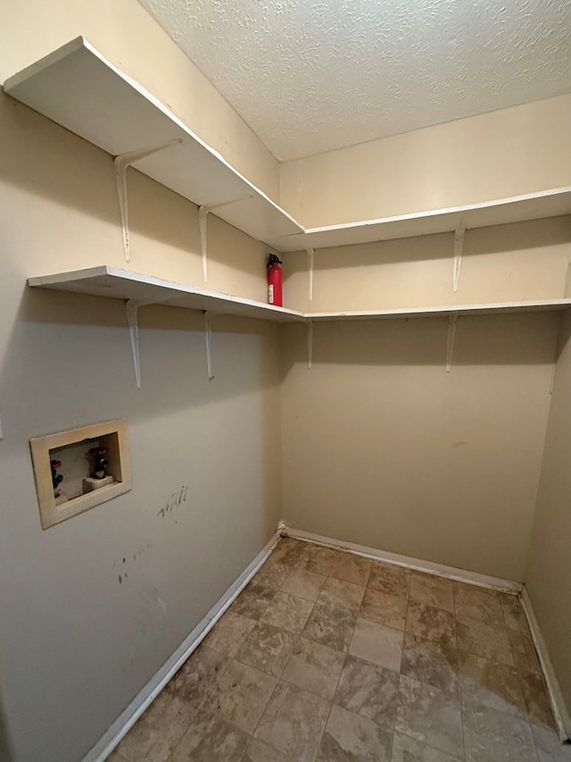 2303 Brown St, Dothan, AL 36303 - washroom with washer hookup, baseboards, and a textured ceiling