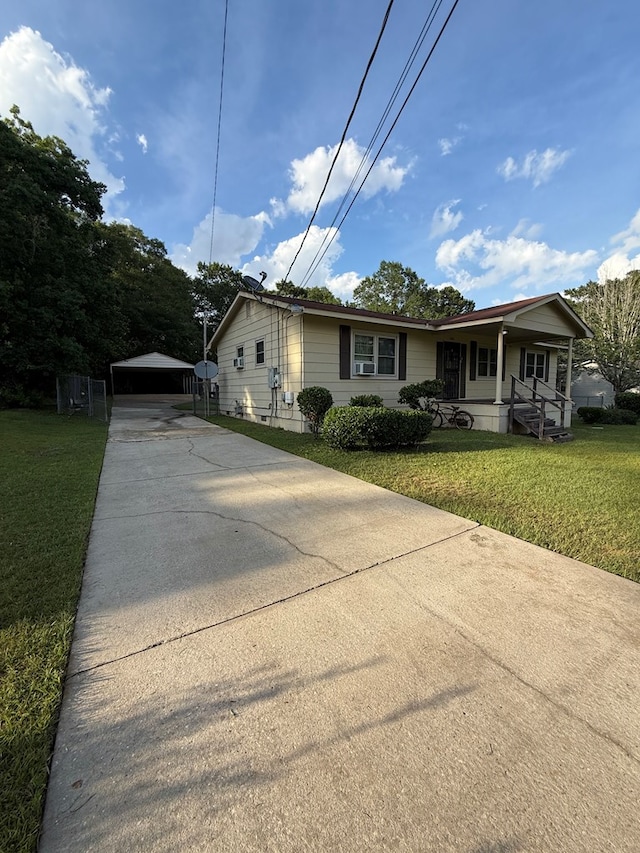 2303 Brown St, Dothan, AL 36303 - view of front of property featuring concrete driveway, a front yard, and a porch