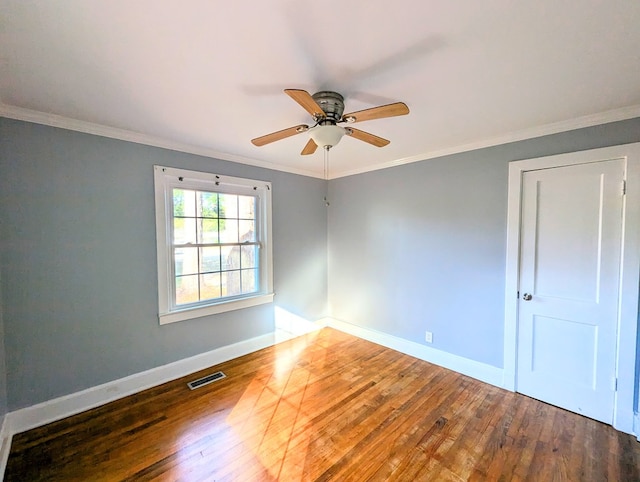 unfurnished room featuring hardwood / wood-style flooring, ceiling fan, and ornamental molding