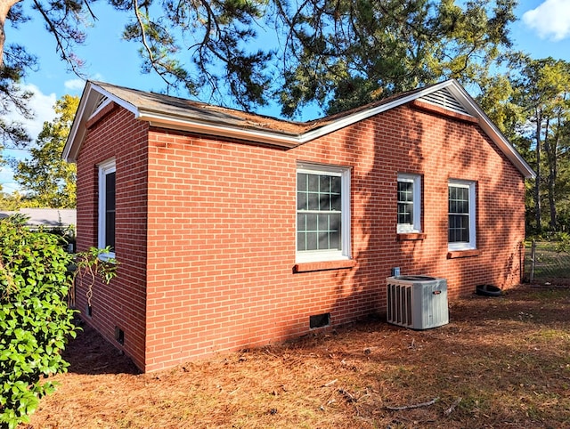 view of home's exterior with central AC