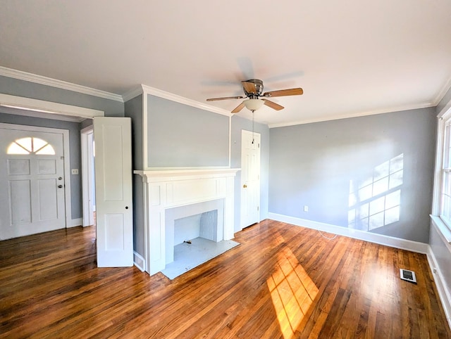 unfurnished living room with hardwood / wood-style floors, ceiling fan, and ornamental molding