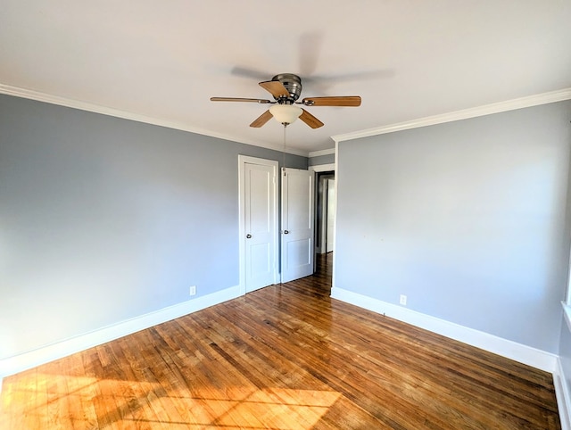 spare room with crown molding, hardwood / wood-style floors, and ceiling fan